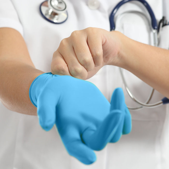 nurse wearing Nitrile Exam Gloves blue color